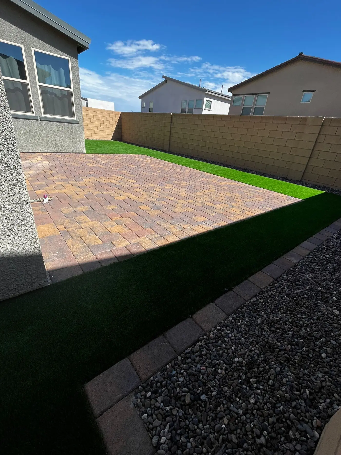 Paver patio in the corner of a Las Vegas backyard