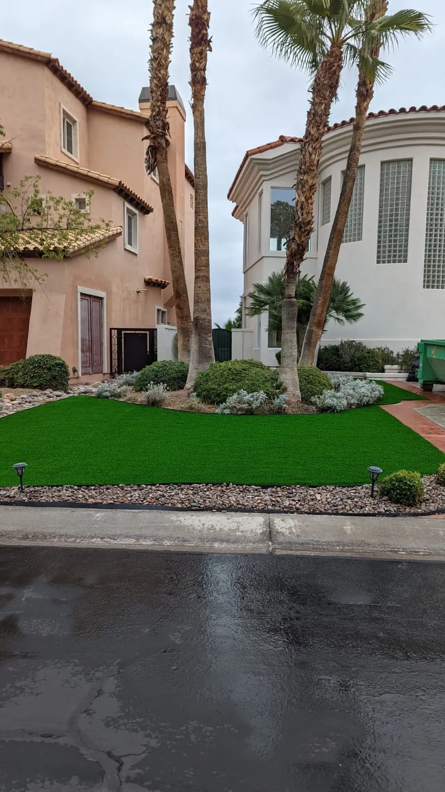 Front yard planting beds with shrubs, turf and rock